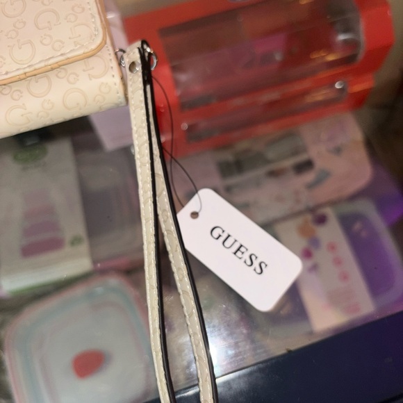 GUESS Cream Logo-Embossed Wristlet Wallet - Picture 4 of 10